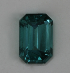 A fine small blue emerald cut.  #357
