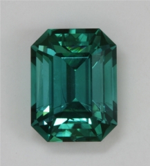 Outstanding, medium toned, blue green, emerald cut.  #373