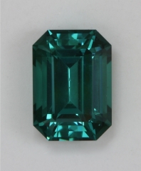 Great, medium toned, open ended, blue green emerald cut.  #377