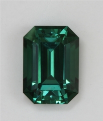Beauty non dichroic medium toned blue green emerald cut.  #380