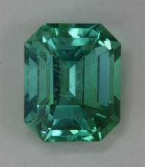 Inclueded cuprian, neon bright blue green emerald cut.  #388