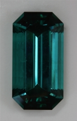 Included, saturated blue green flash, emerald cut.  #393