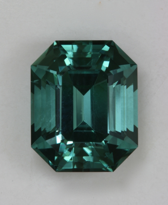 Beautiful, medium toned blue green emerald cut. #376