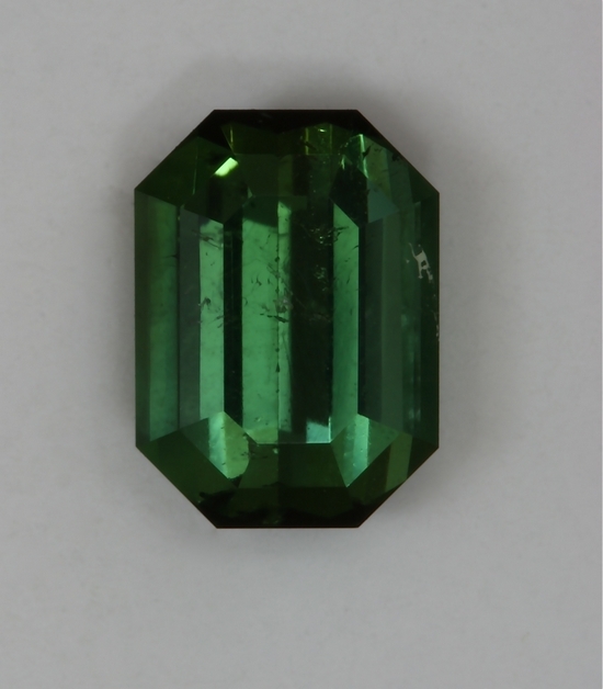 Included green emerald cut with closed ends.  #403