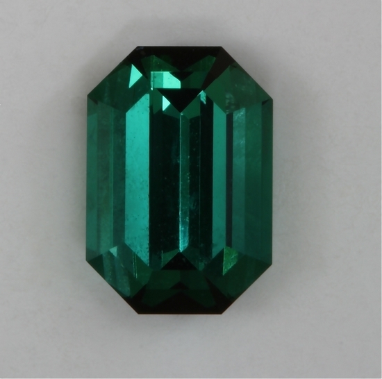 Closed ends and great a/b axis green color, emerald cut.  #410