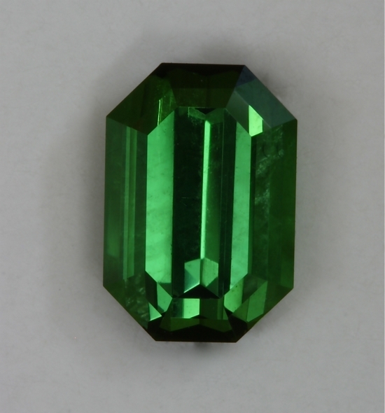 Closed ended, nice green, eye clean emerald cut.  #414