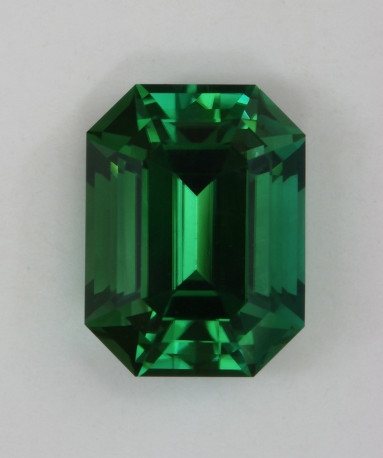 Beautiful, completely open, bright green with touch of blue emerald cut.  #426