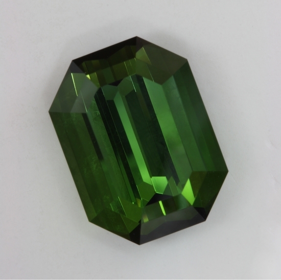 Large, closed ended, brownish yellow green emerald cut.  #436