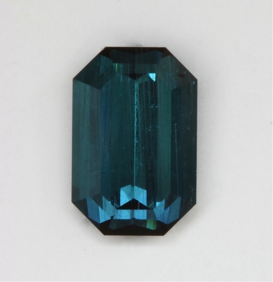 Closed ended, poorer crystal, medium dark blue emerald cut.  #443